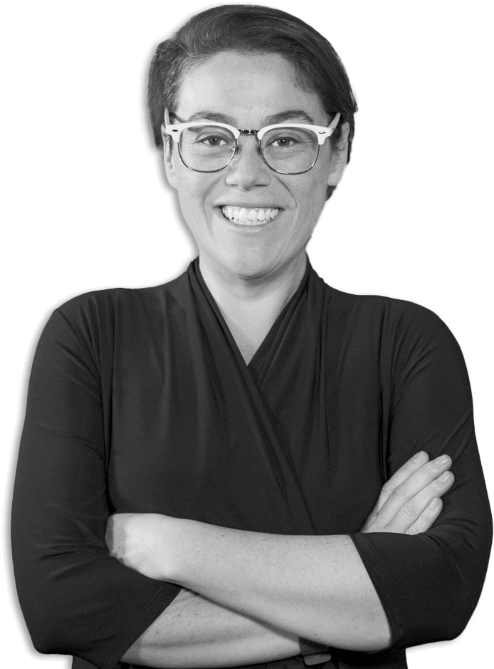 sara_macfarlane_bw_transparent_cropped_short Sara smiling with arms crossed